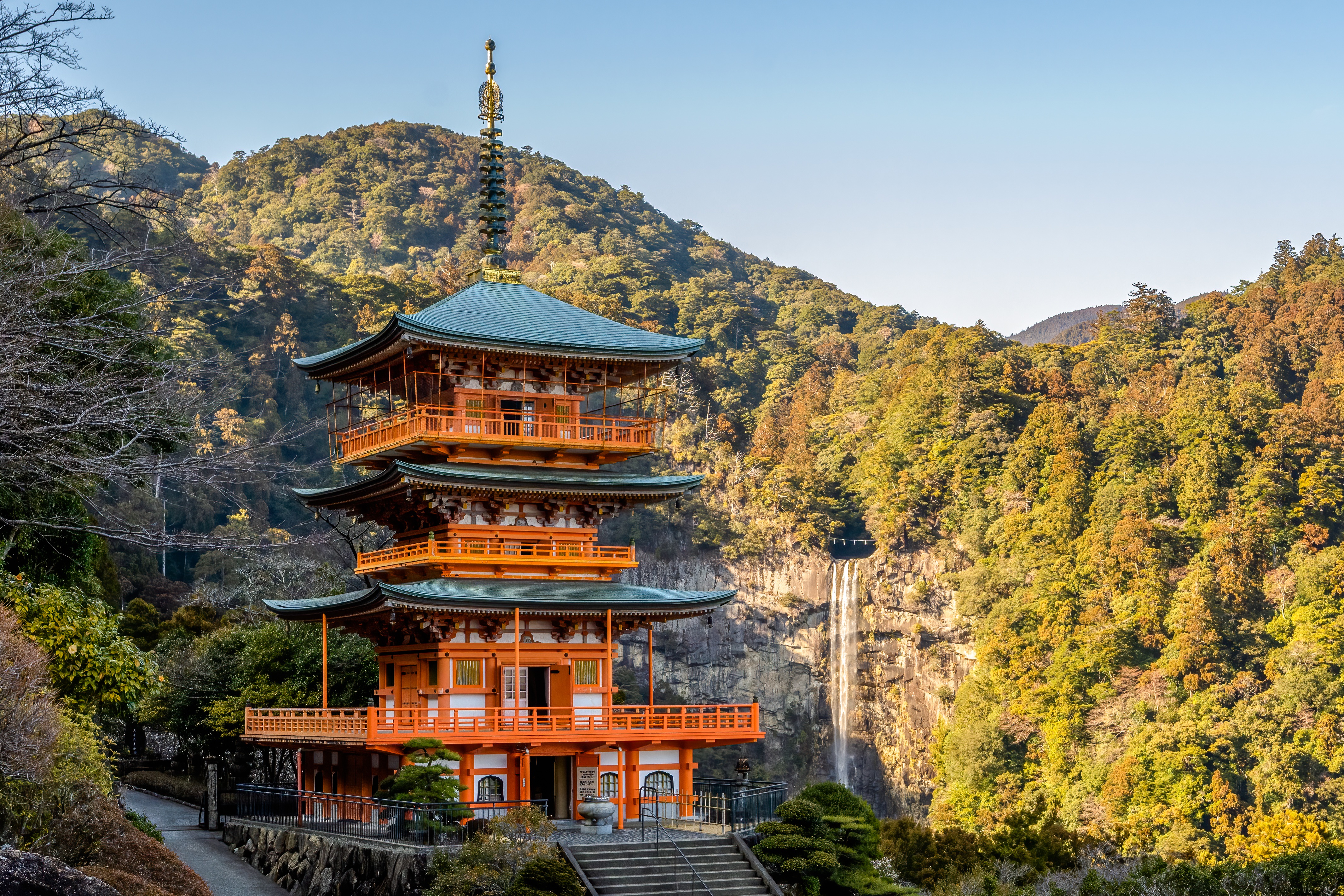 The red pagoda of Seiganto-ji Temple next to Nachi Falls, a 133-meter waterfall in the Kumano region of Wakayama Prefecture, Japan